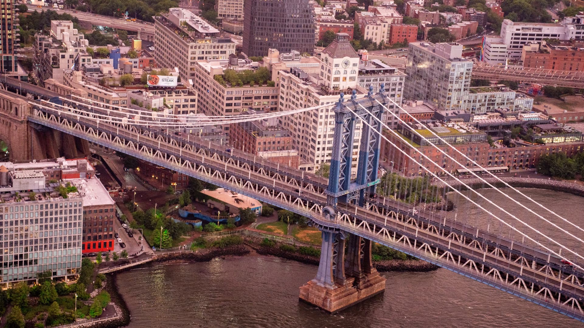Aerial view of the Manhattan Bridge and Brooklyn at dusk